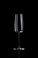 Empty champagne glass isolated on black background.