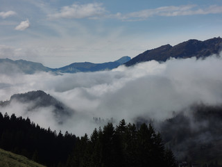 Views of the cloudy valley from the Col des Mosses in the Bernese Alps of Switzerland
