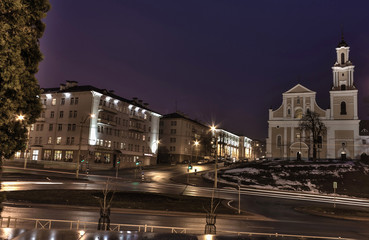 Fototapeta na wymiar Sights and views of Grodno. Belarus. Panorama of the evening city. City streets. Bernardine church.