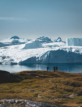 3 people taken photo of Humpback whale in Ilulissat diving in Greenland. Easy hiking route to the famous Kangia glacier near Ilulissat in Greenland. The Ilulissat Icefjord seen from the viewpoint.
