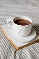 cup of coffee in scandinavian style. Breakfast in bed