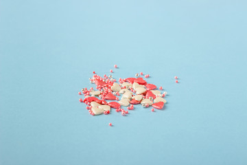 Pink cookie heart shaped with different patterns, blue background