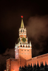 Fototapeta premium Russian Kremlin with red star and clock by night