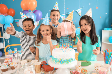 Little children celebrating Birthday at home