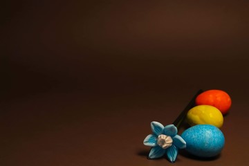Glass blue flower with colorful easter eggs