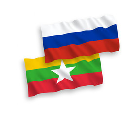 Fototapeta premium Flags of Myanmar and Russia on a white background