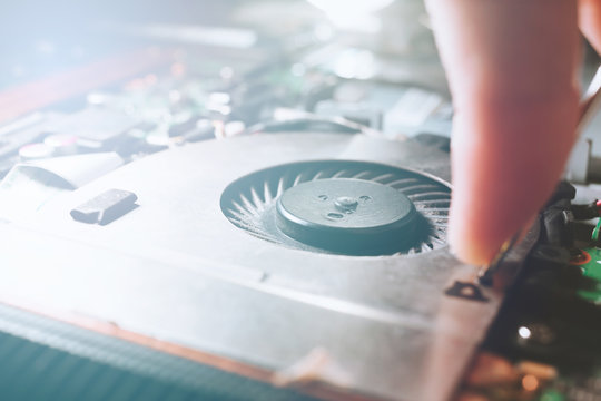 Computer part repair. Close Up of microprocessor cooling. Engineer fixing pc components.