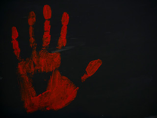 drawing bloody handprint on a black background
