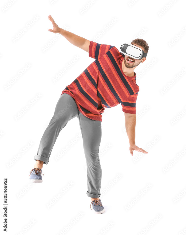 Wall mural Young man with virtual reality glasses on white background - Wall murals