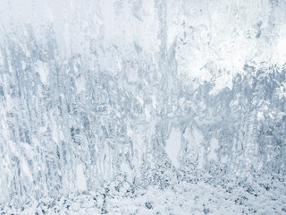 Texture of the ice, frost on a glass with motif. Winter background.