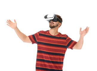 Young man with virtual reality glasses on white background