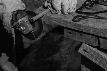 An experienced welder at work. Preparation and welding process of cast iron furnace. Selection...