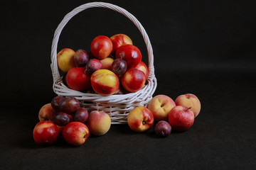 full basket of apples on a black background