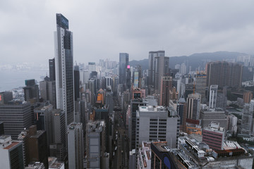 Hong Kong city landscape day and evening with lights. Skyscrapers overlooking the mountains and the sea day and evening. Night lights. China