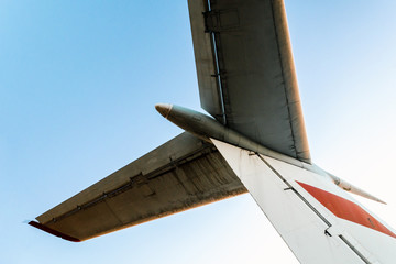 wings of a large soviet airliner against a blue sky