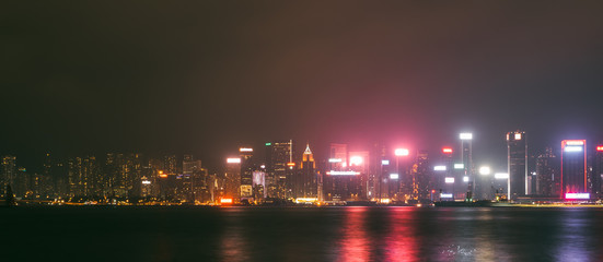 Fototapeta na wymiar Hong Kong city landscape day and evening with lights. Skyscrapers overlooking the mountains and the sea day and evening. Night lights. China