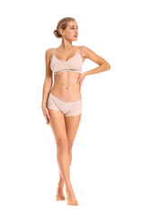 Obraz premium Beautiful young woman in underwear on white background