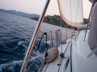 Tailwind, the concept of moving forward on all sails. Boat trip on a yacht under sail,