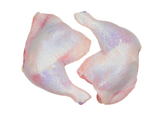 Two raw chicken pieces on a white background