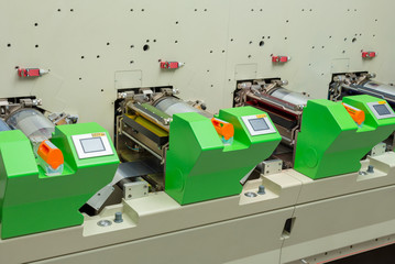 Flexographic printing press. Rotary / flexo press machine. In-line printing machine. Close-up shot...