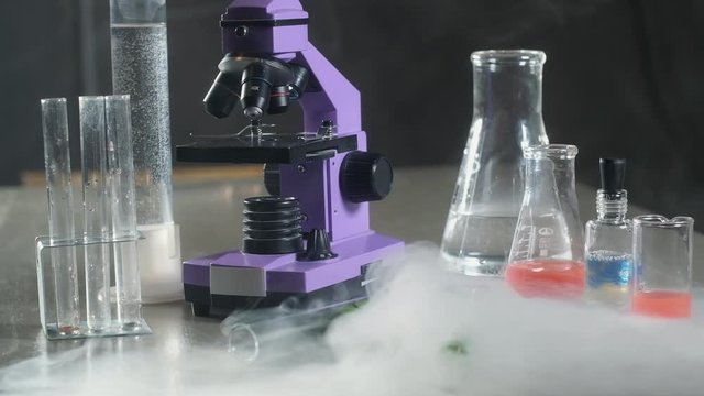 scientific or medical laboratory.  Nitrogen evaporates from test tubes and beakers. Cryogen. Frozen samples of the virus or vaccine. pharmaceutical research and development concept.