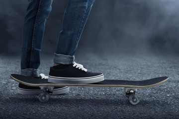 Fototapeta na wymiar Skateboarder skateboarding on the street