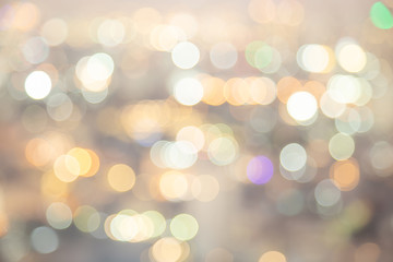 Fototapeta premium Bokeh light in the fastival in the evening at Bangkok , Thailand. Abstract bokeh yellow light of the city in night time and soft color.