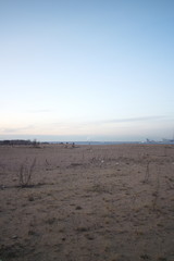 Wasteland at the construction site of a residential quarter on the outskirts of the city in the autumn evening