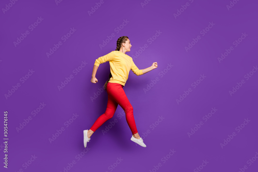 Poster Full length profile photo of funny millennial lady jumping high rushing sale shopping speed running wear casual yellow pullover red trousers isolated purple color background