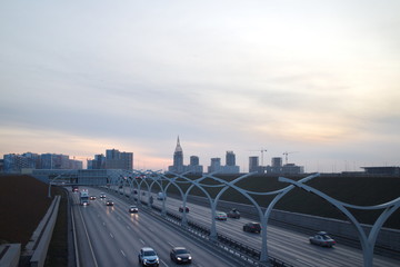 Expressway on the outskirts of the city on a fall evening