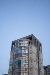 High-rise building sharp angle view in autumn twilight