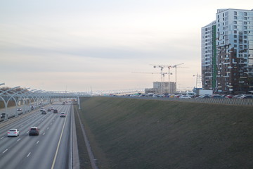 Expressway on the outskirts of the city on a fall evening
