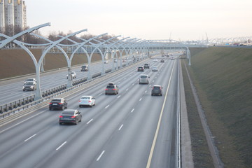 Expressway on the outskirts of the city on a fall evening