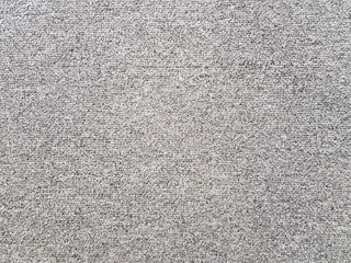 Close up shot of grey floor carpet detail show surface and texture of the fabric work. Pattern...