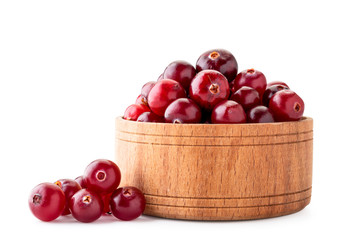 Ripe cranberries in a wooden plate on a white background. Isolated