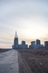 Naklejka premium Construction of a residential quarter on the outskirts of the city on an autumn evening