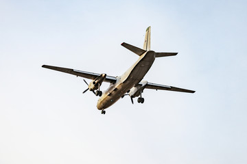 Freight plane in the clear sky at evening time.