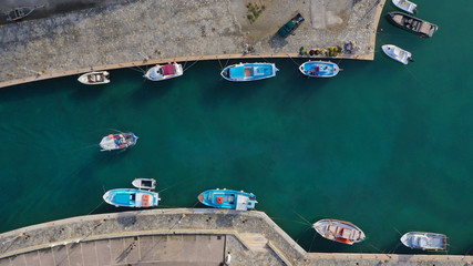 Fototapeta na wymiar Aerial drone photo of traditional wooden fishing boat in old port of Mykonos island, Cyclades, Greece
