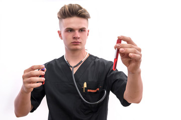 Medical worker in laboratory looking on red blood in test tube analyzing it