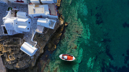 Aerial drone photo of traditional wooden fishing boat in old port of Mykonos island,  Cyclades,...