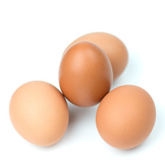 Four brown eggs separated with isolated from the white background.