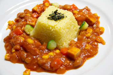  butter rice and vegetarian sauce on plate