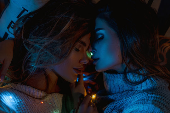 Women at Christmas Holidays, on the background of the Christmas tree concept of friendship and relationship. LGBT 