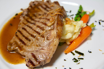  beef steak with brown sauce and vegetables