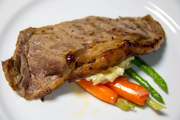  beef steak with brown sauce and vegetables