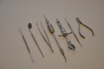 Dental equipment. Row of various dental tools on white.