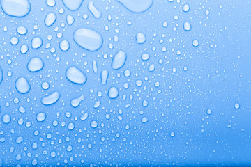 Drops of water on a color background. Selective focus. Blue. Toned