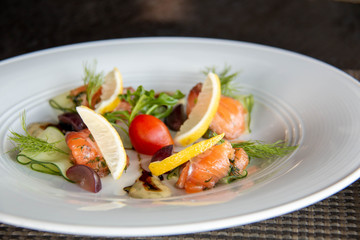 mixed Salmond salad on white plate