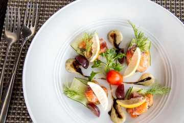  mixed Salmond salad on white plate