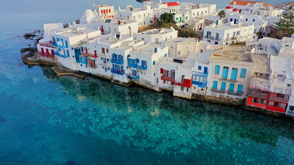 Aerial panoramic view of world famous whitewashed little Venice picturesque settlement in main village of Mykonos island with beautiful deep blue sky and clouds, Cyclades, Greece - obrazy, fototapety, plakaty